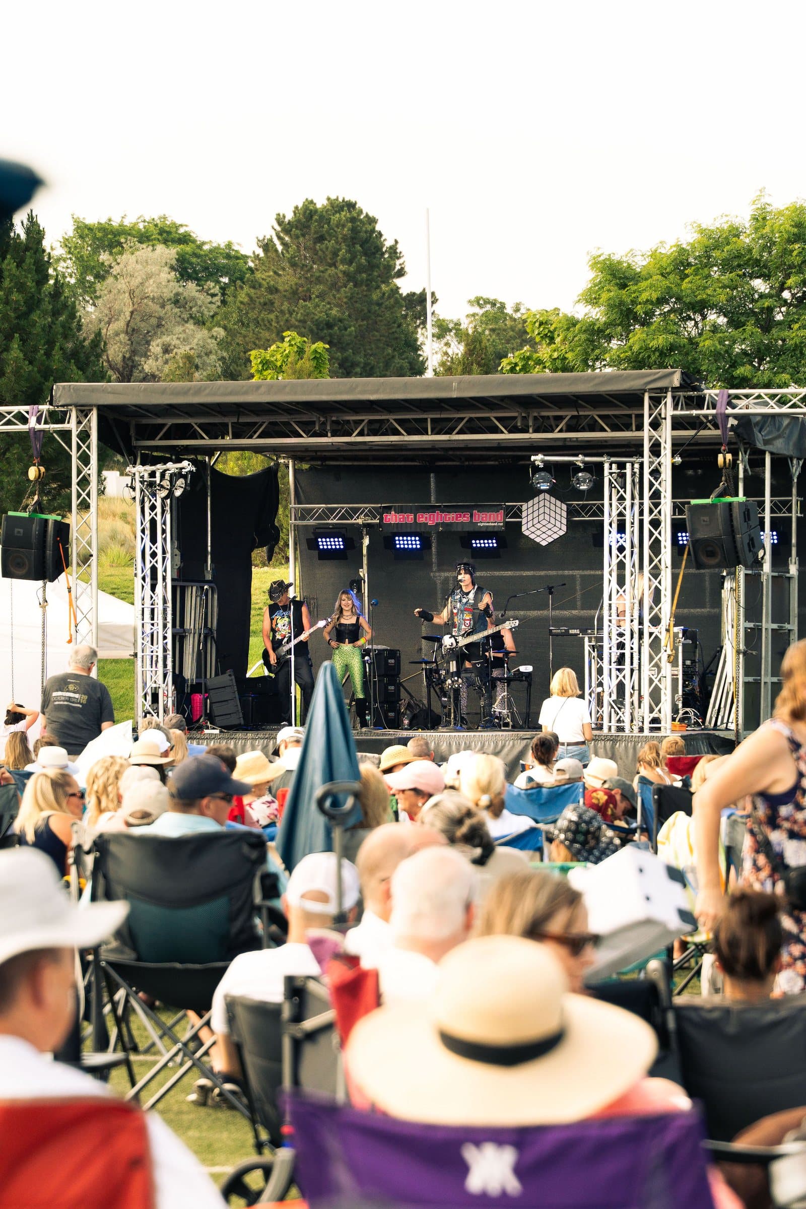 Concert crowd in lawn chairs watching That Eighties Band in Castle Pines, Colorado
