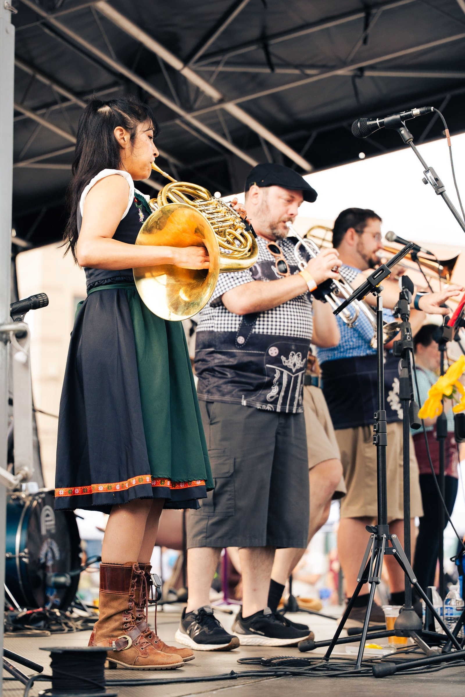 Singer in a dirndl performing with the band at Castle Rock Oktoberfest, Colorado festival photography