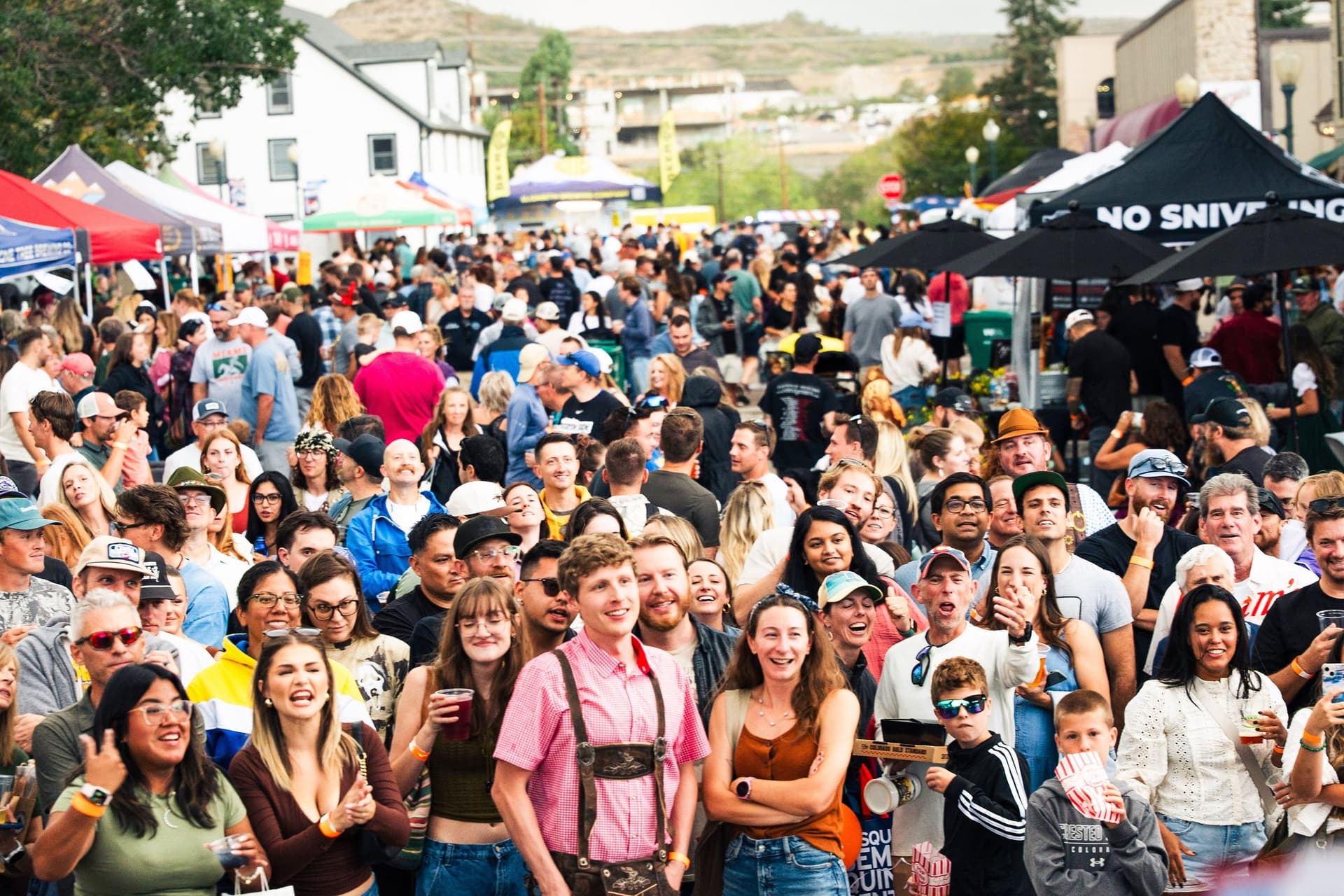 Crowd of friends celebrating in costume at Castle Rock Oktoberfest 2026