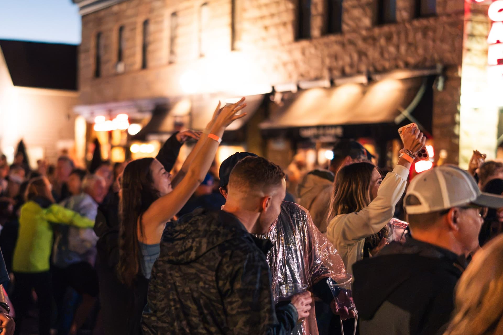 Festival crowd dancing at night on the streets of Castle Rock during Oktoberfest 2026