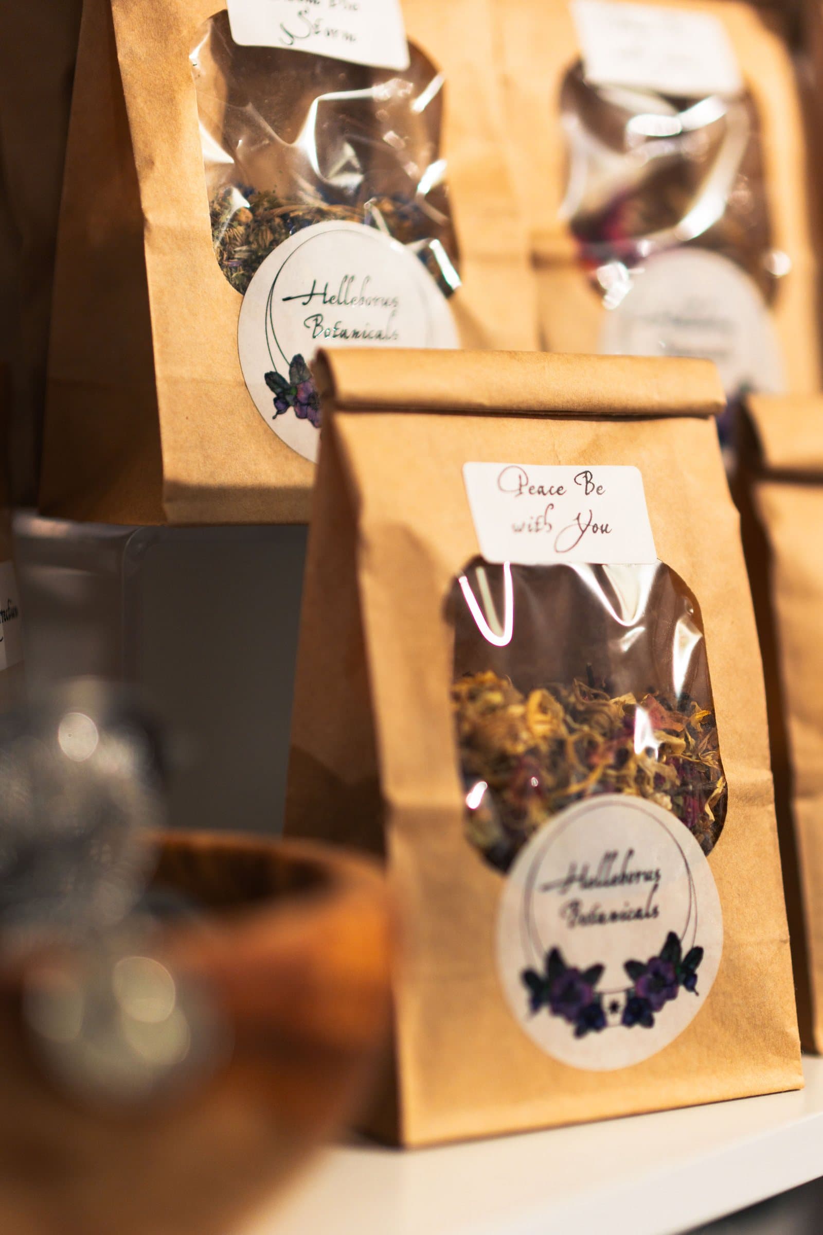 Packaged handmade goods in kraft bags at Corner Nook boutique