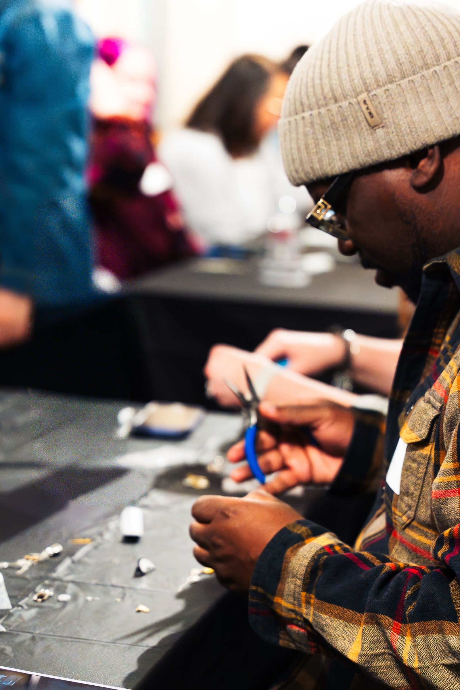 Artisan assembling jewelry at Corner Nook boutique, Colorado brand photography