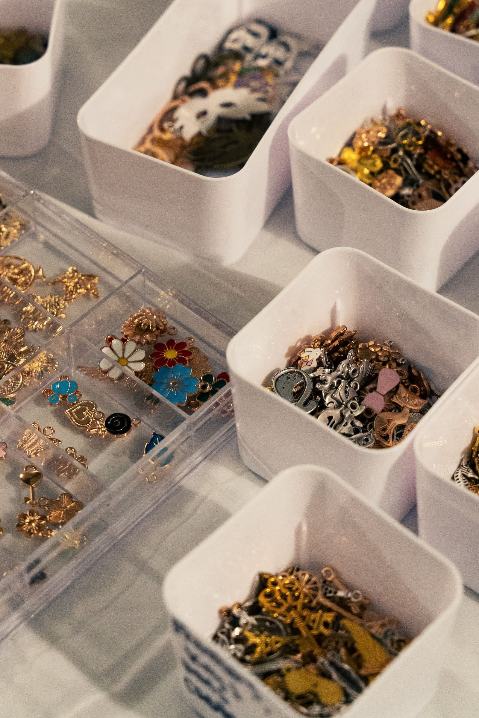 Trays of jewelry charms at Corner Nook's make-your-own bar