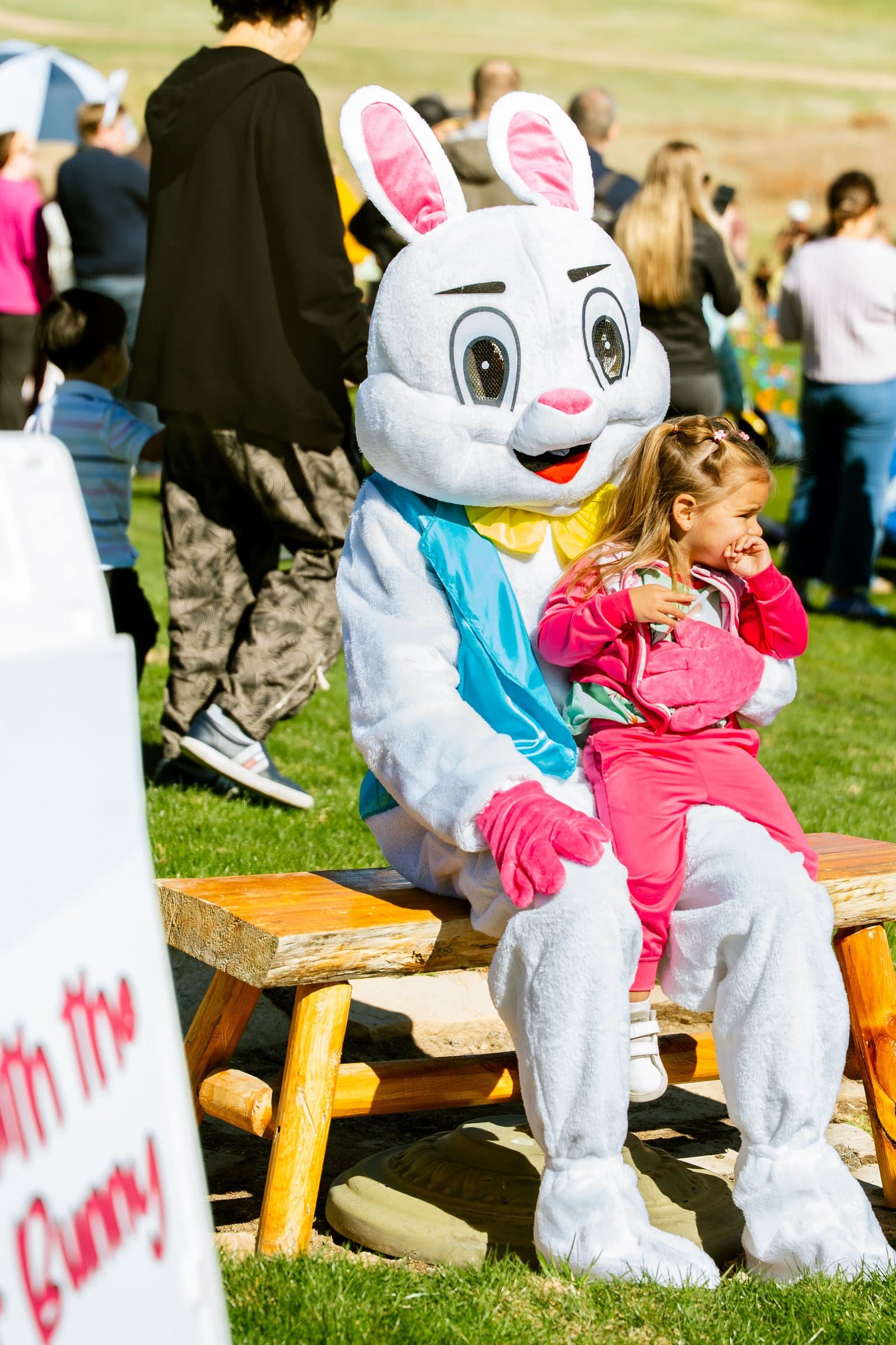 Girl hugging the Easter Bunny at the 2026 community Easter egg hunt, Colorado event photography