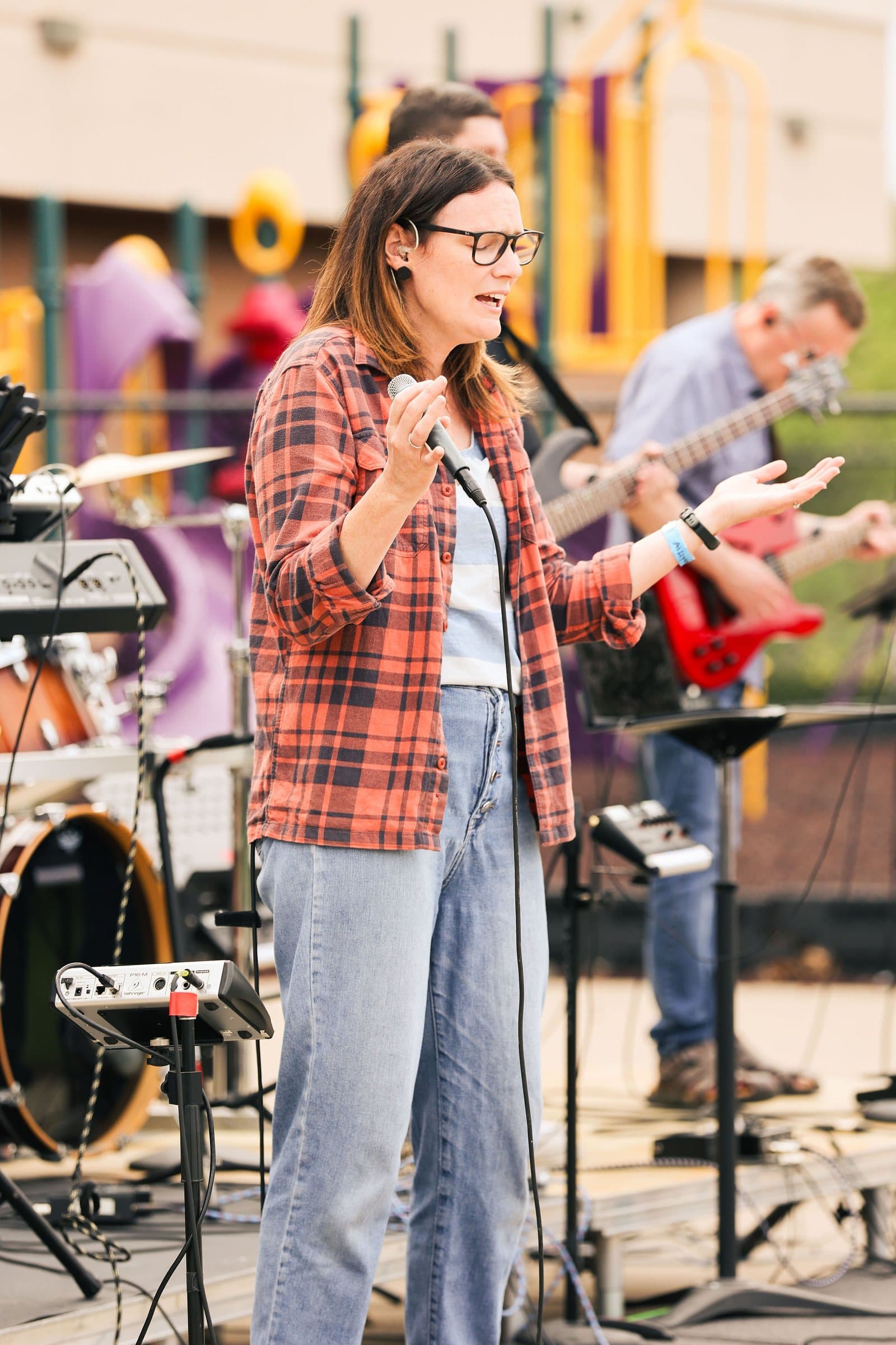 Worship leader singing during Mountain View church's outdoor service