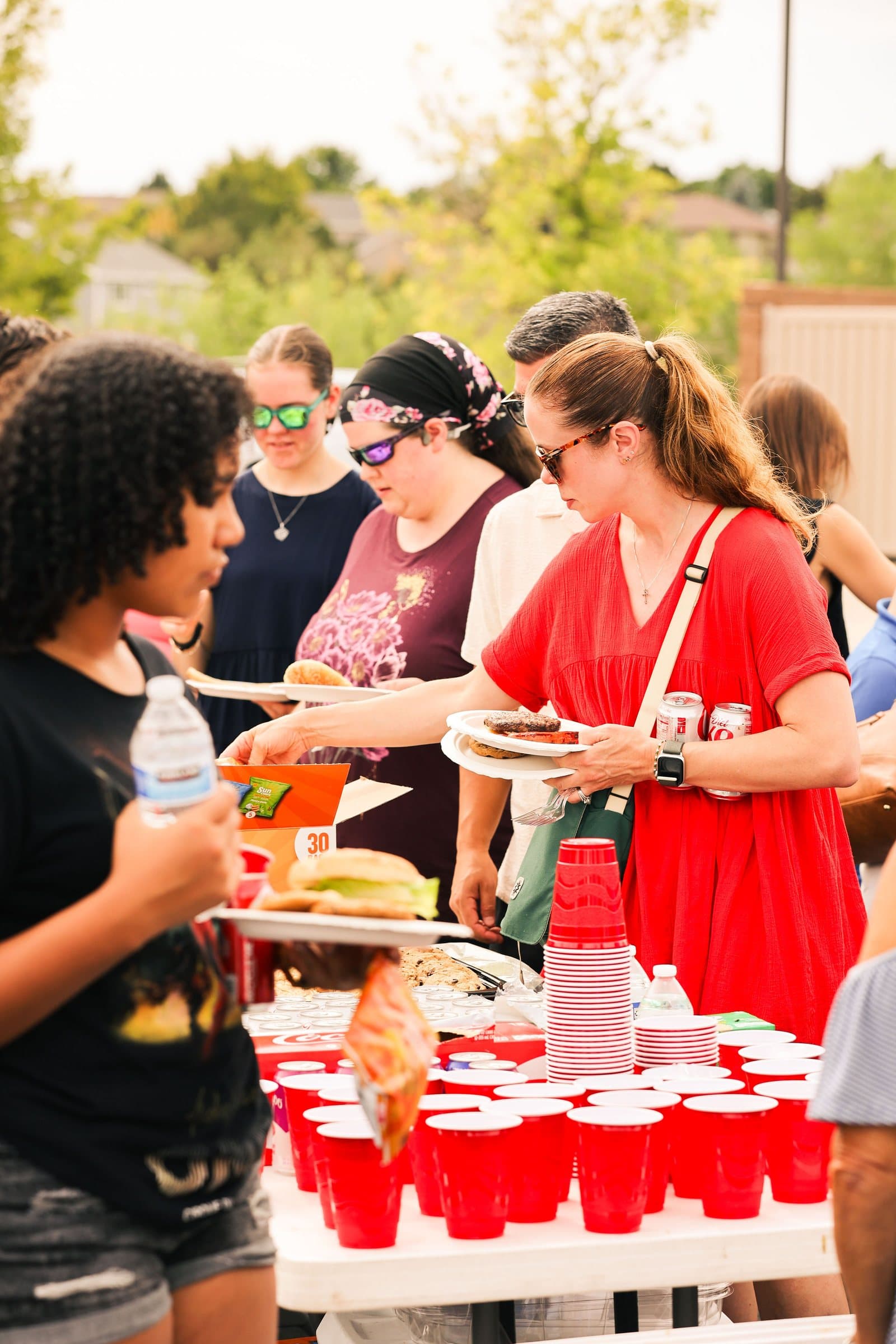 Volunteers serving food at the Mountain View church community picnic