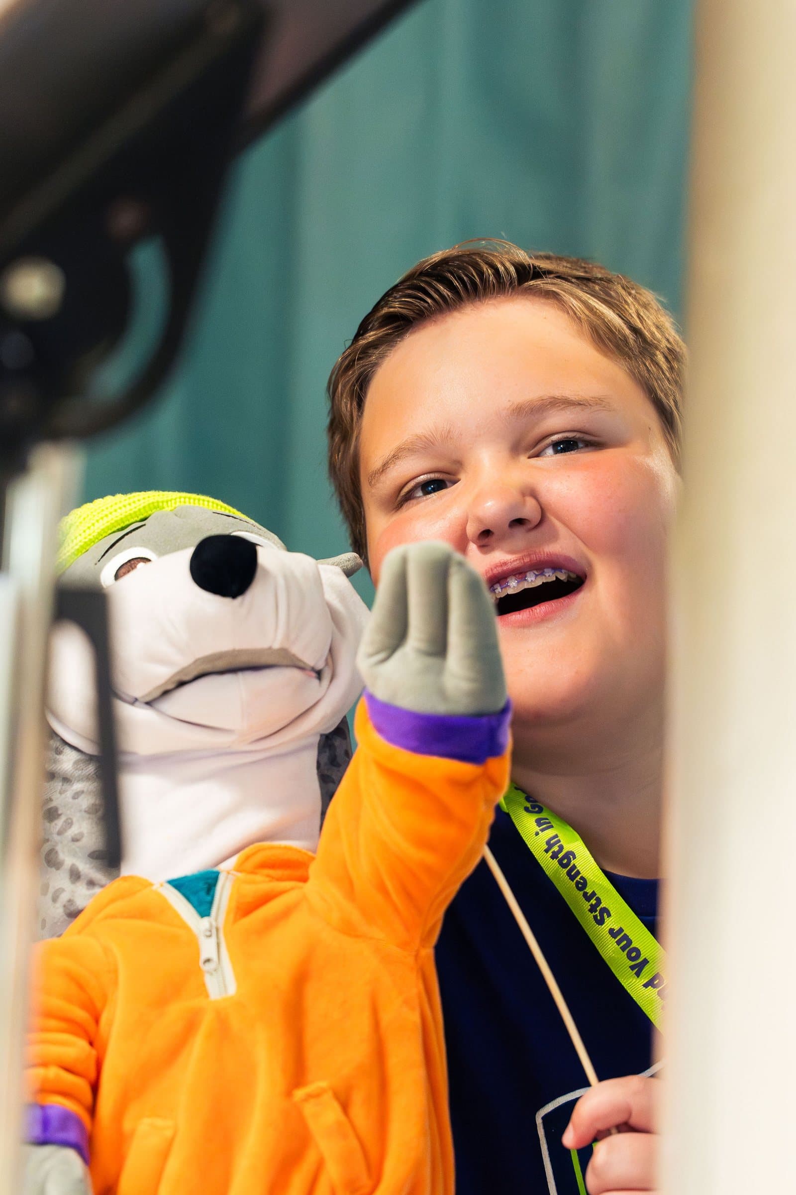 Boy laughing with a puppet at Vacation Bible School 2026, Colorado event photography