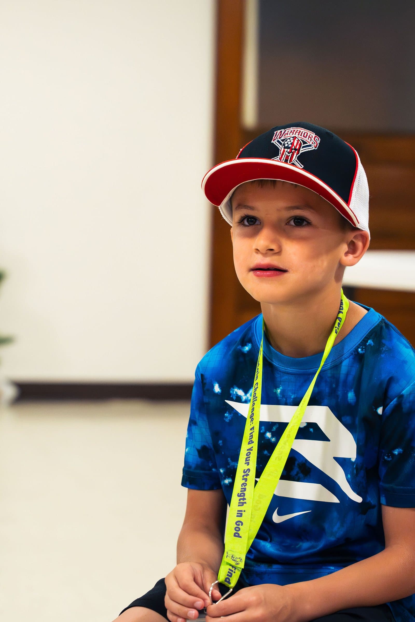 Portrait of a smiling boy in a baseball cap at VBS 2026