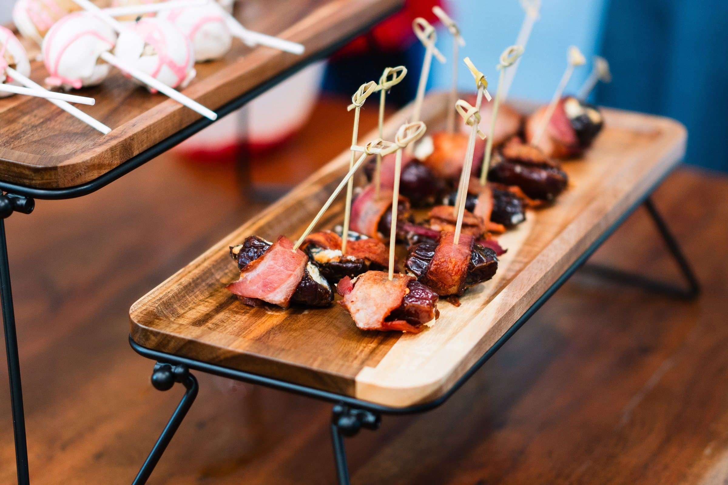 Steak skewers on a raised wooden serving board, Colorado catering photography