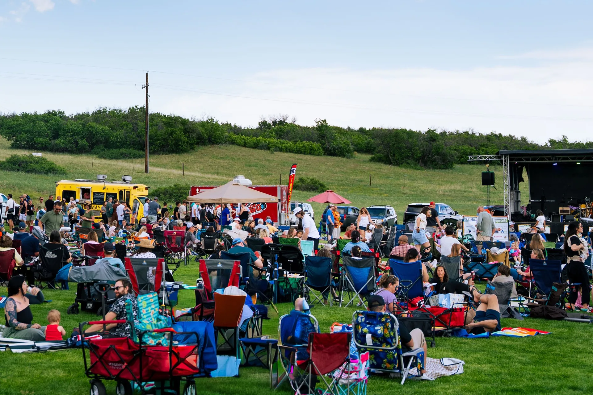 Crowd picnicking on the lawn at Castle Pines Food Truck Frenzy 2026