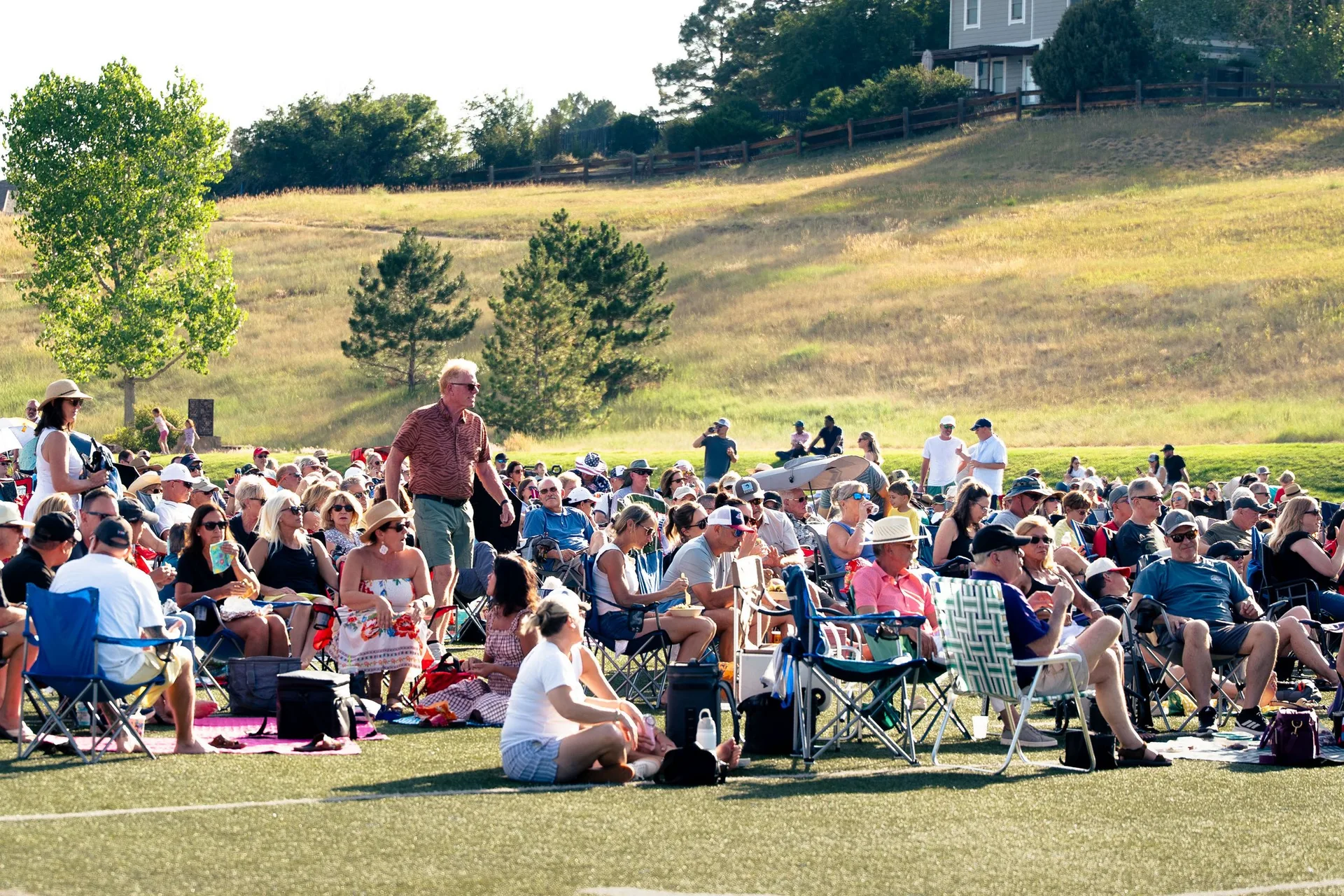 Wide view of the packed lawn at the Castle Pines community concert
