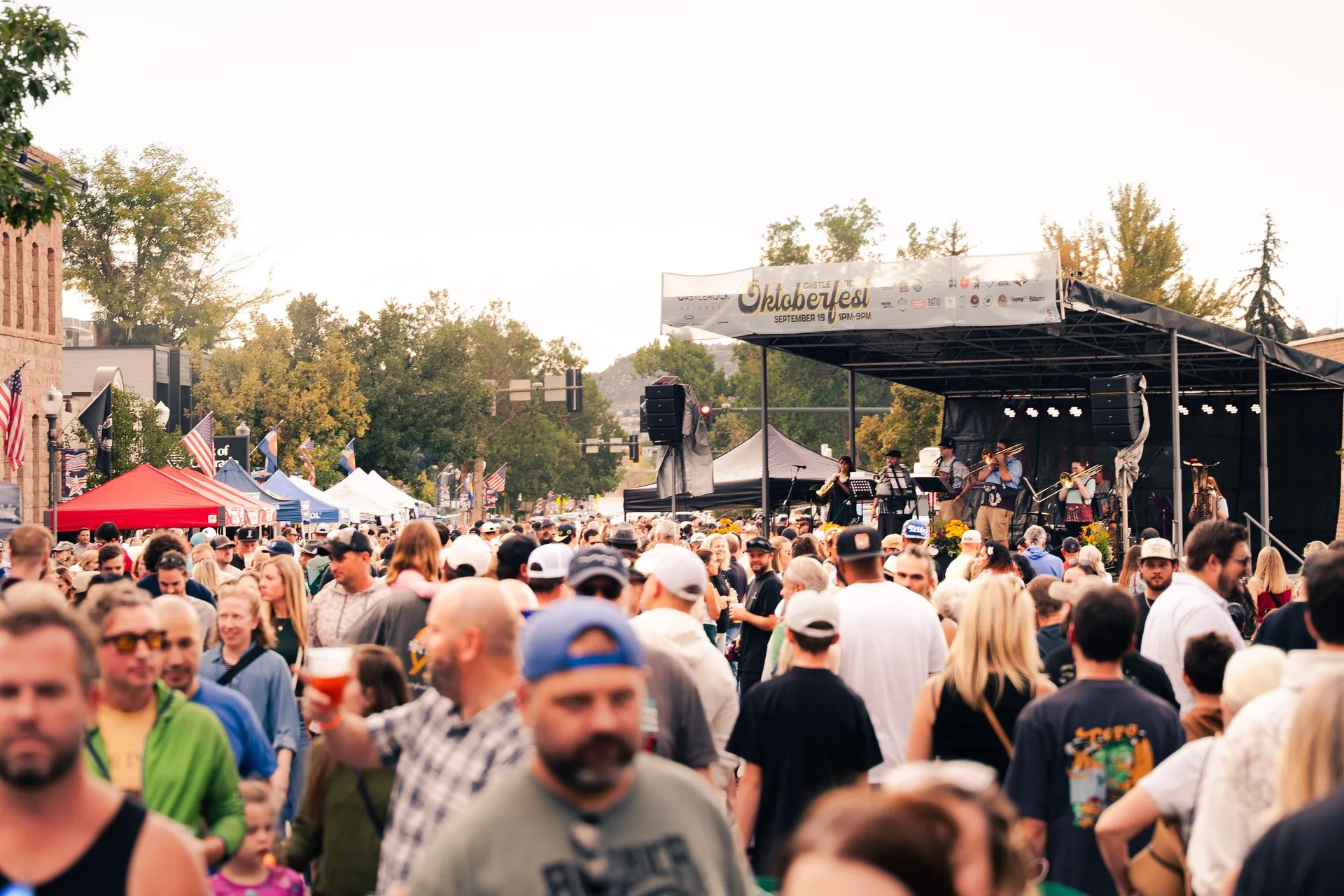 Crowd filling downtown Castle Rock at Oktoberfest 2026, Colorado event photography