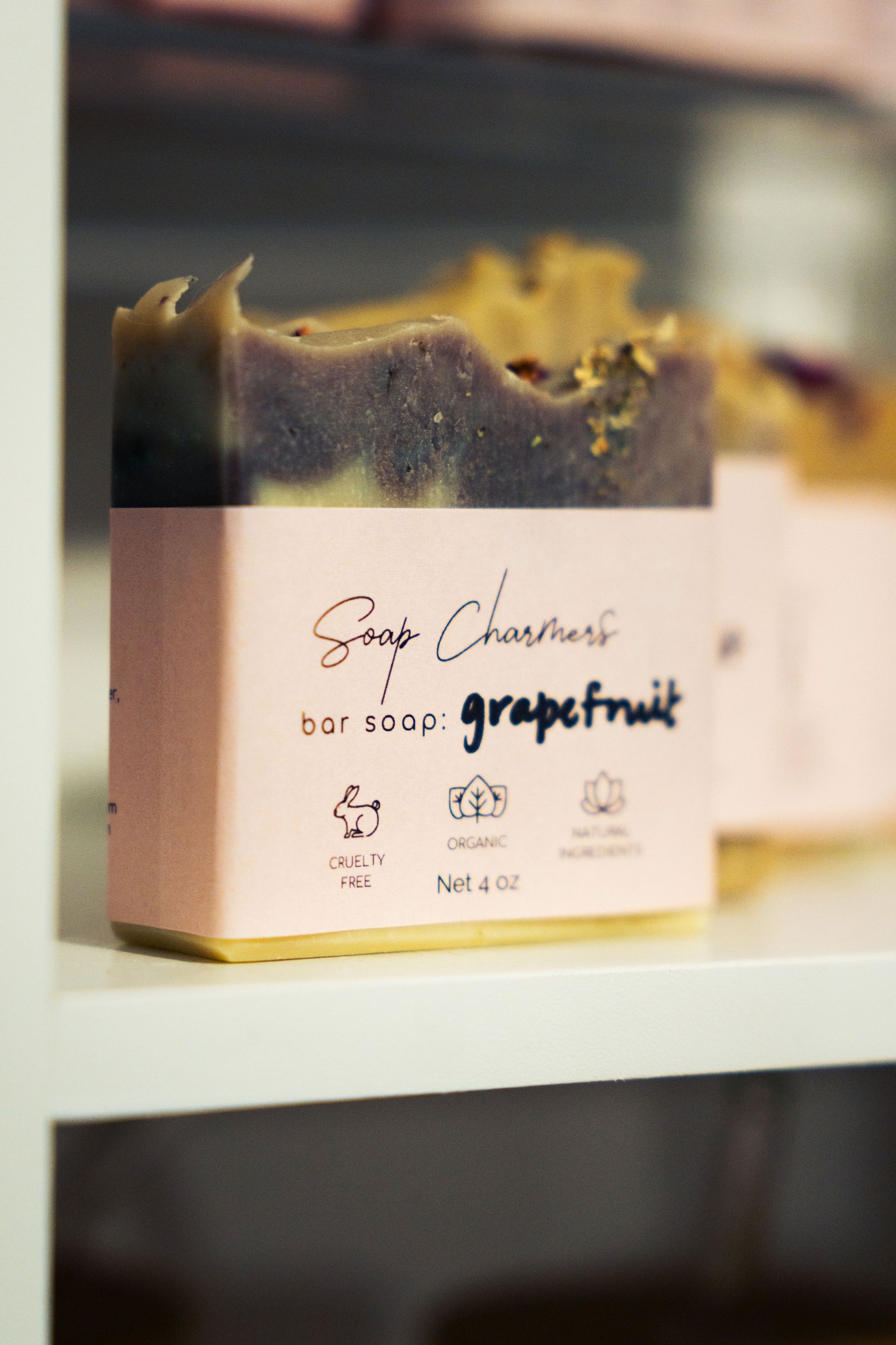 Handmade soap bars with branded labels, small business product photography