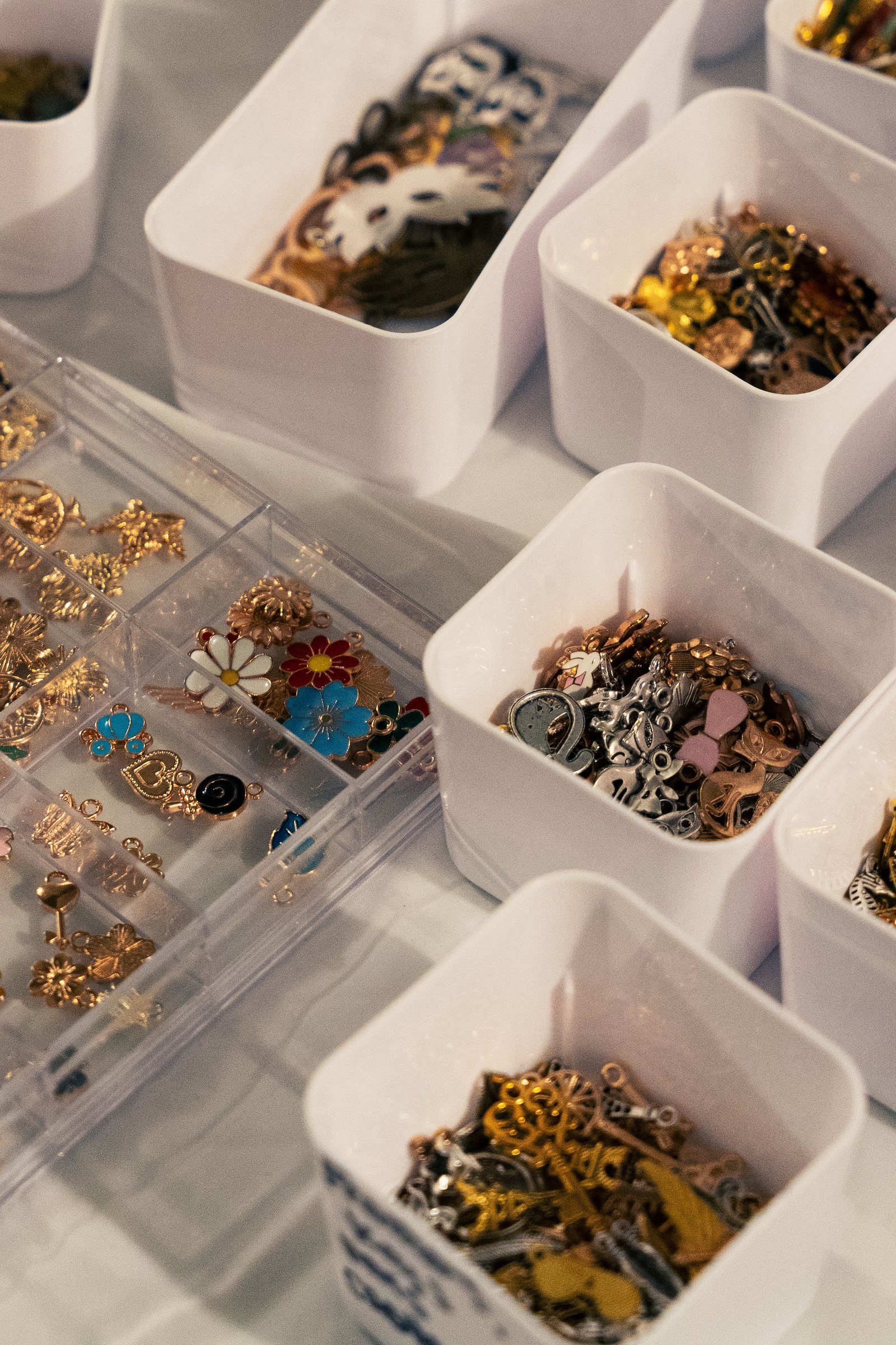 Trays of jewelry charms at Corner Nook's make-your-own bar