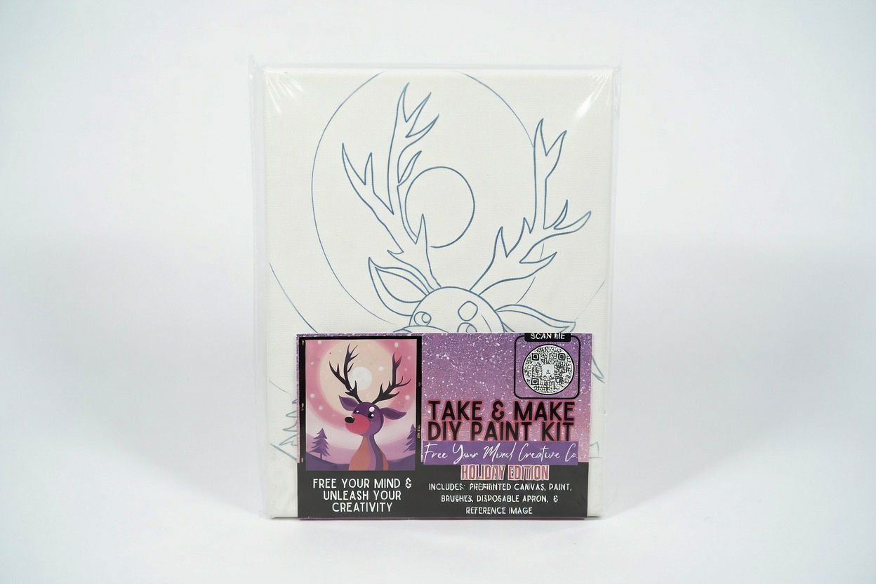 Take-and-make paint kit with pre-drawn canvas on a white backdrop