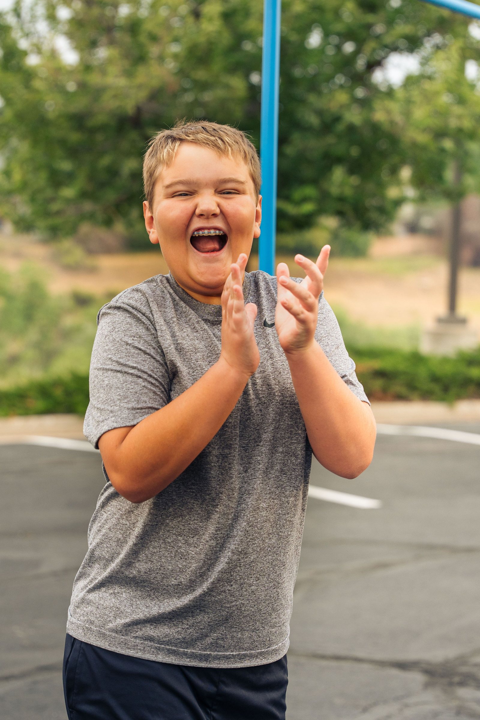 Laughing teen cheering during a youth group game night at Mountain View church
