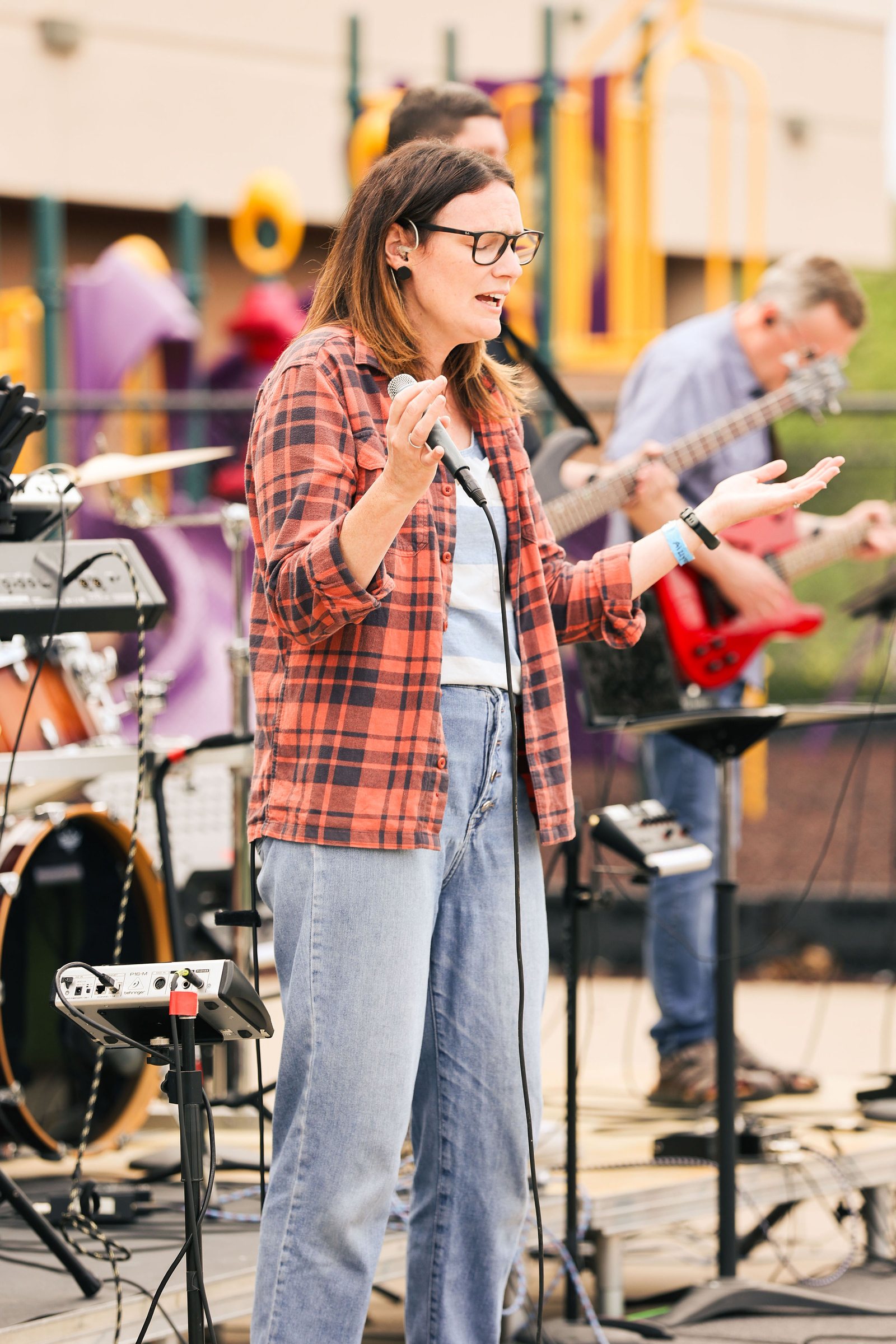 Worship leader singing during Mountain View church's outdoor service