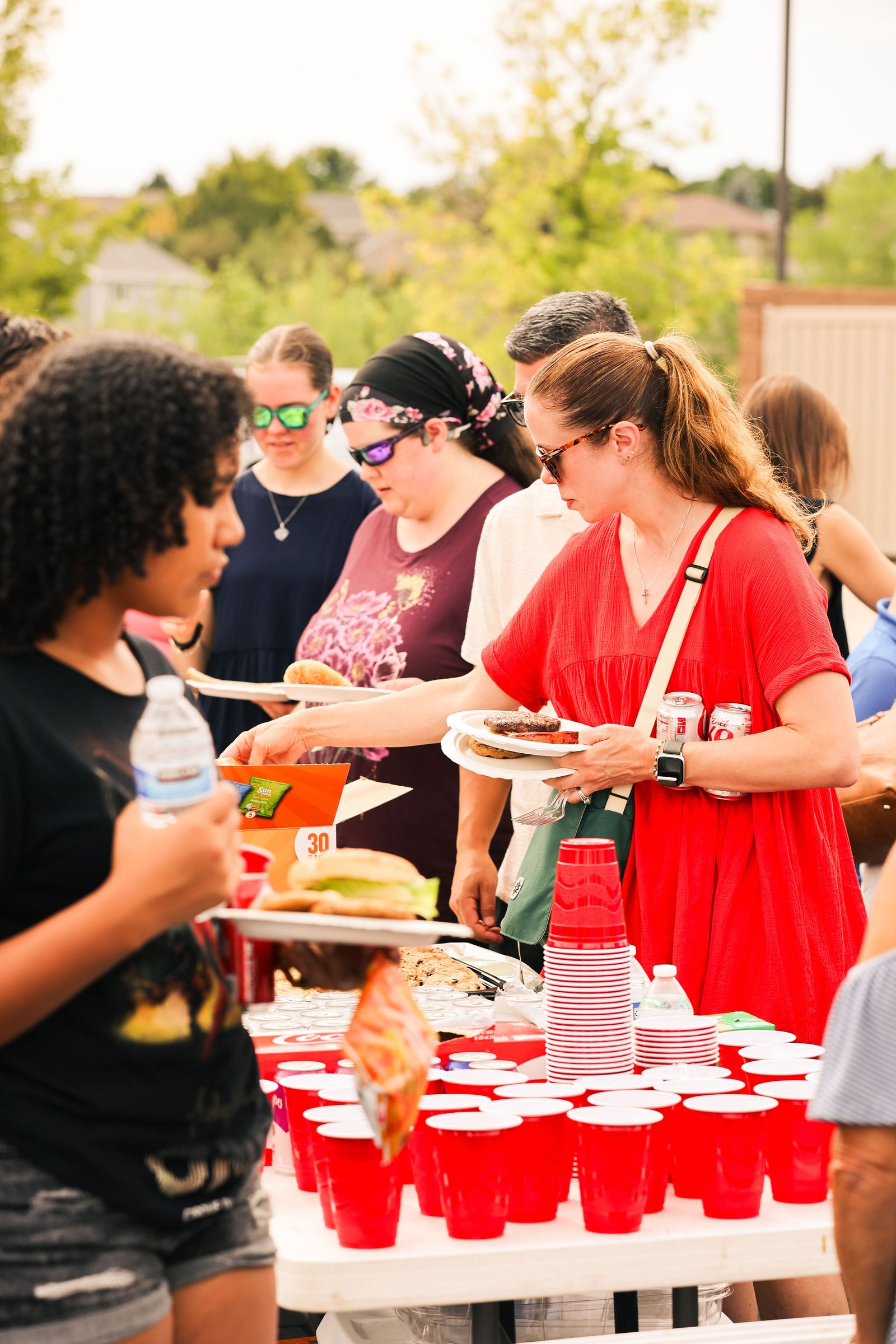 Volunteers serving food at the Mountain View church community picnic